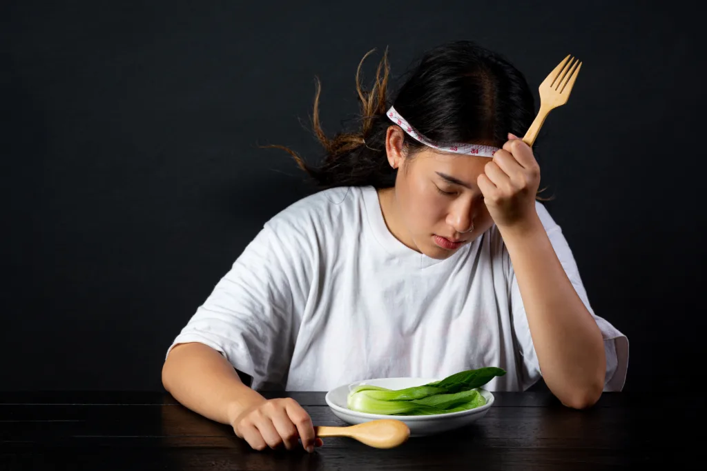 depressed woman hungry from dieting